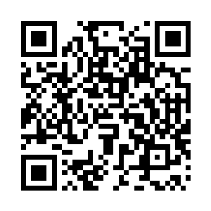 桌子上摆放着一株修剪得十分得体的翠绿文竹二维码生成